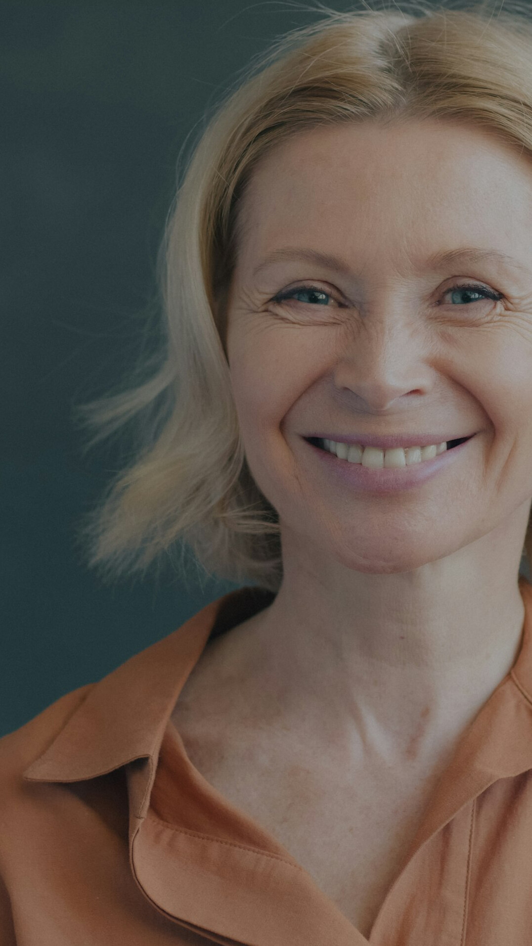 Professional woman with short hair smiling